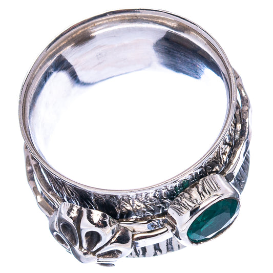 Sterling silver ring with green gemstone and engraved side floral details
