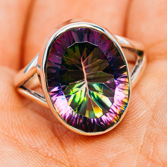 Oval faceted iridescent gemstone set in sterling silver band, size 6.75, dark multi-color