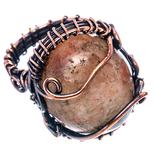 Oxidized copper wire-wrap ring with oval cabochon stone and circular wire band