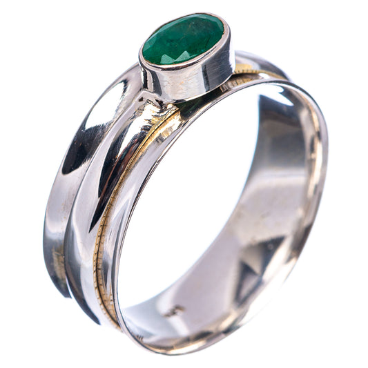 Sterling silver spinner ring side view with prong-set oval green gemstone