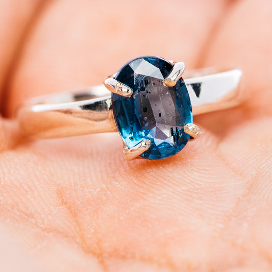 Sterling silver kyanite ring with faceted deep teal-blue oval stone, size 6.5