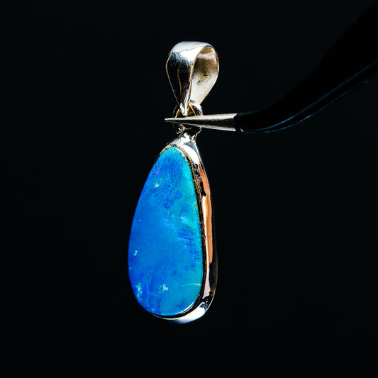 Sterling silver fire opal pendant with blue teardrop stone and side-profile bail