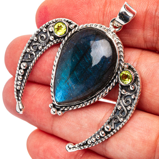 Heart-shaped labradorite pendant in sterling silver with peridot halo accents