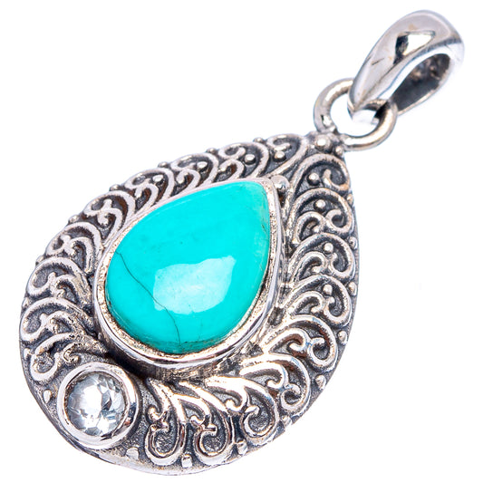 Sterling silver pendant with turquoise teardrop stone, filigree edge, and two round clear stones