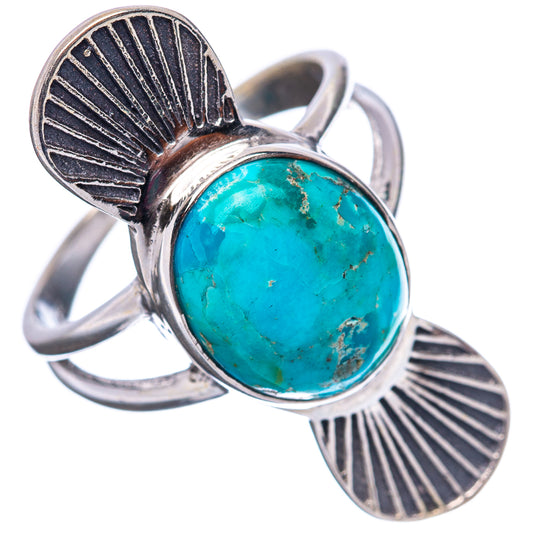 Sterling silver turquoise ring with oval cabochon, raised bezel, and fan leaf bands