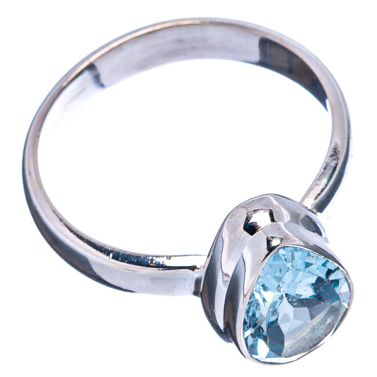 Sterling silver ring with raised oval faceted blue topaz on band