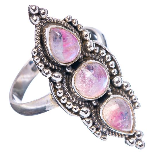 Sterling silver moonstone ring showing three pink oval stones and raised bezel sides