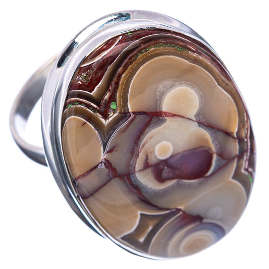 Sterling silver ring with crazy lace agate oval cabochon, cream circles and dark red bands.