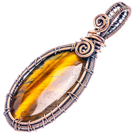 Oxidized copper wire-wrap pendant featuring oval tiger’s eye cabochon in spiral frame