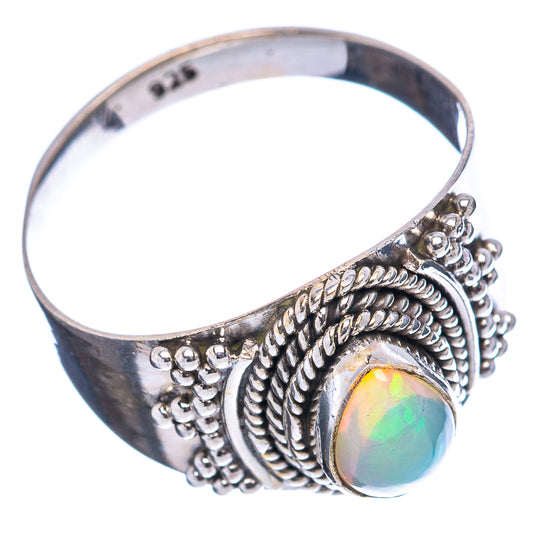 Sterling silver opal ring with stacked rope-like bezel and iridescent oval gem