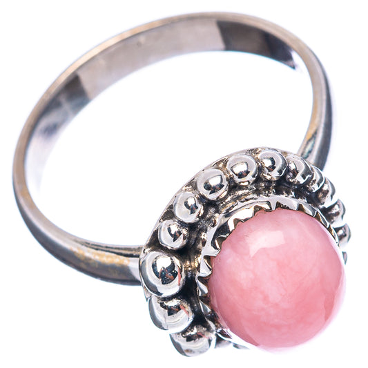 Sterling silver ring with pink opal cabochon and beaded halo, side view