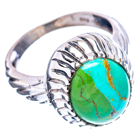 Turquoise oval cabochon sterling silver ring with carved filigree band, side view