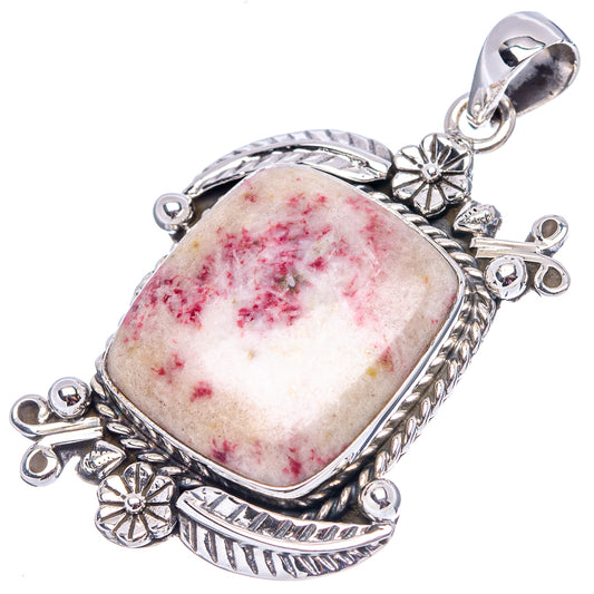Oval cinnabar pendant .925 sterling silver, silver bail and carved border with red speckled stone