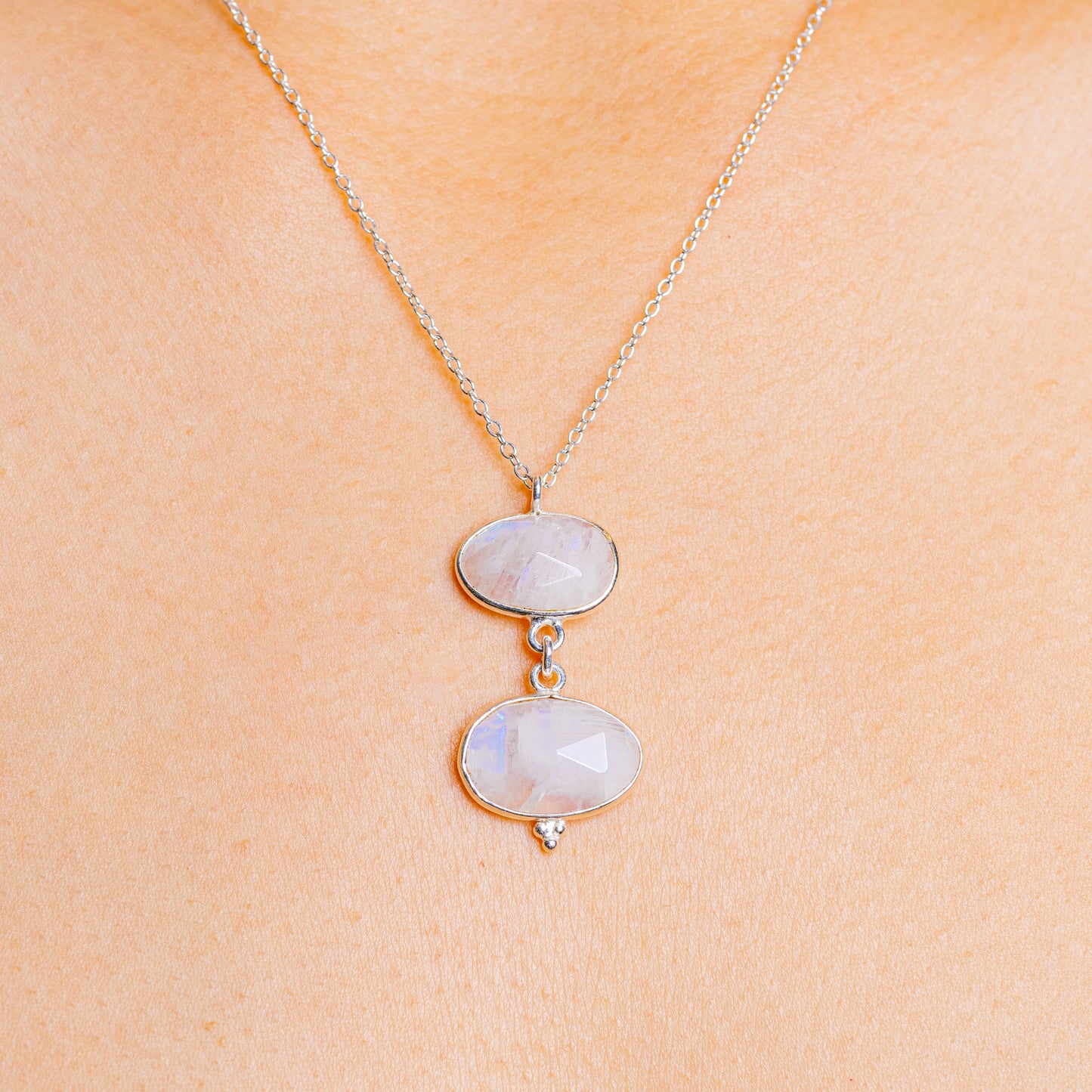 Sterling silver necklace with two oval rainbow moonstone pendants