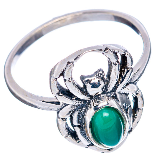 Sterling silver spider ring with oval green gemstone and sculpted web band