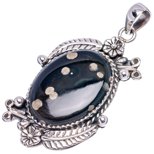 Obsidian galaxy pendant with dark oval stone, silver rope bezel, flower charms