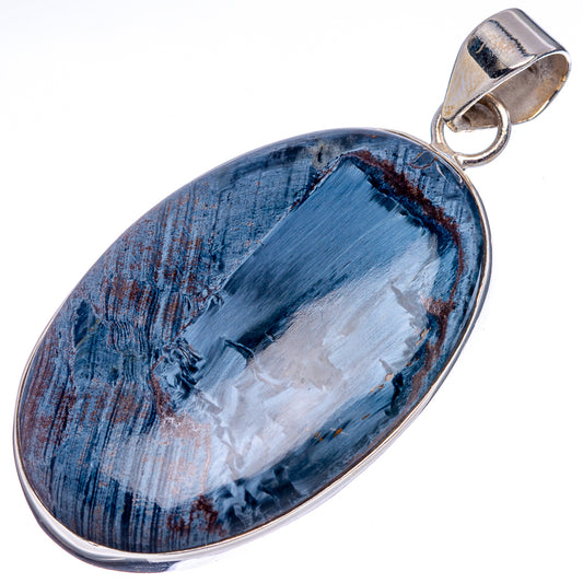 Oval pietersite pendant with blue-black marbled stone in sterling silver bezel and bail.