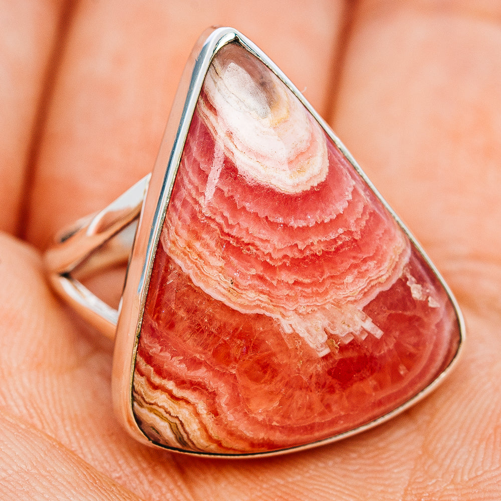 Teardrop rhodochrosite cabochon ring in sterling silver, side view, size 8