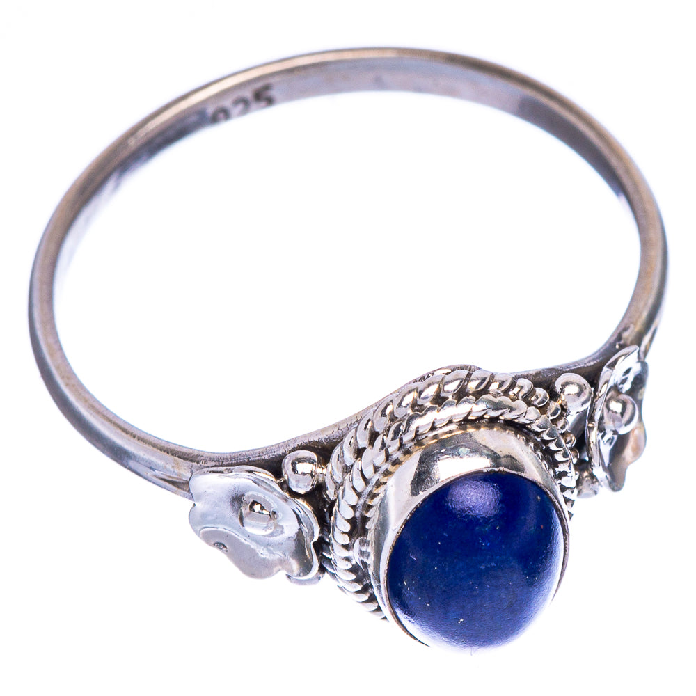 Sterling silver lapis lazuli ring with oval blue gemstone and flower side details