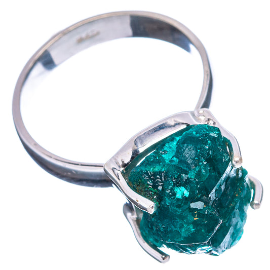 Sterling silver dioptase ring angled view, rough green stone on open prongs