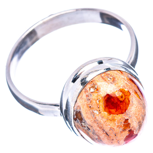 Sterling silver fire opal ring with oval orange stone bezel on polished band