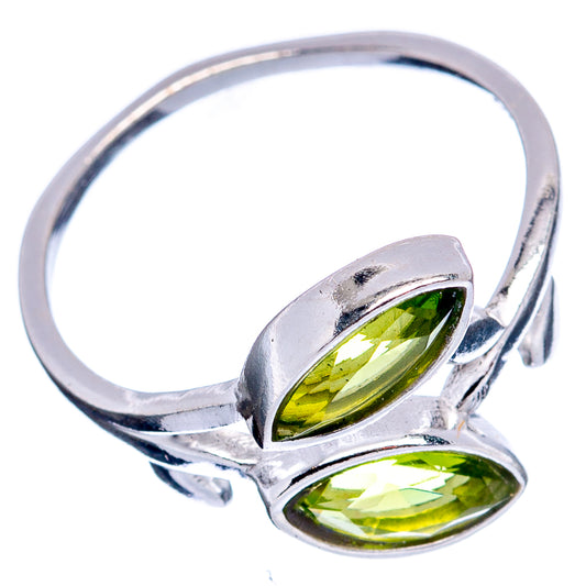 Sterling silver peridot leaf ring with two green teardrop stones, open cuff style