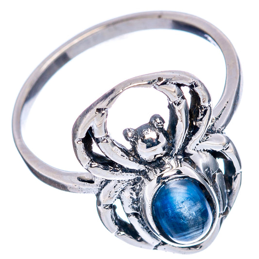 Sterling silver spider ring with oval blue kyanite cabochon and raised web-like setting