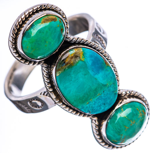 Adjustable sterling silver ring with three oval turquoise cabochon stones, angled view