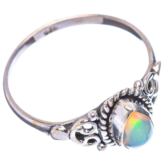 Sterling silver ring with oval opal center and ornate side cutouts