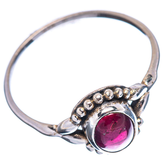 Dainty garnet ring (.925 sterling silver) with pink-red oval stone and bead border