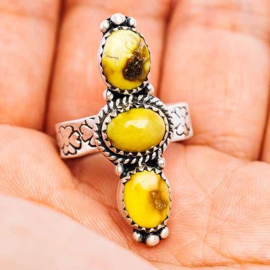 Adjustable sterling silver ring with three yellow oval stones and floral side engraving