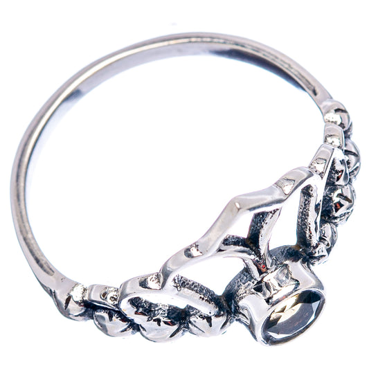 Sterling silver ring with twisted band and crown-style top with small citrine center
