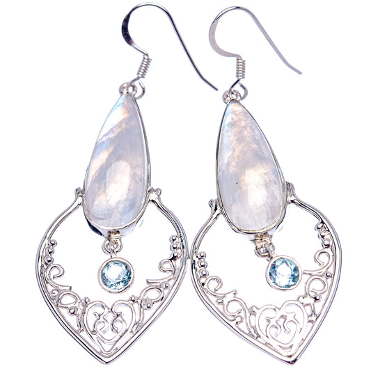 Pair of teardrop moonstone earrings, ornate filigree with blue topaz drops