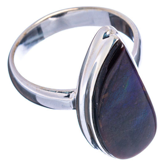 Sterling silver ring with raised teardrop ammolite stone in dark blue-purple iridescence