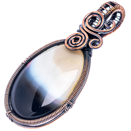 Oxidized copper wire-wrapped teardrop agate pendant with banded white and dark center