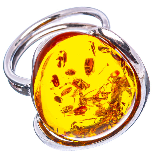 Adjustable sterling silver ring with oval Baltic amber cabochon, yellow and honey tones