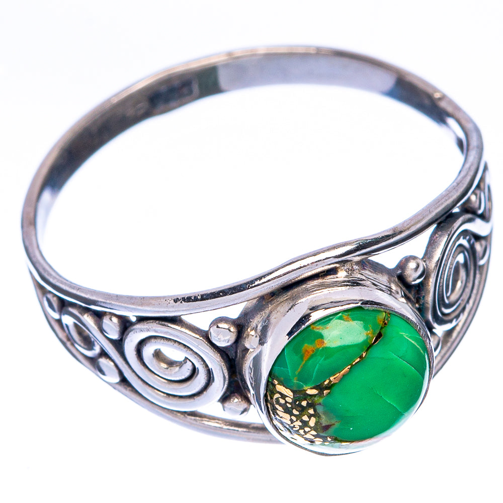 Sterling silver ring with oval green turquoise cabochon on a swirl-pattern band
