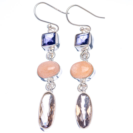 Sterling silver drop earrings with blue square, peach round, and faceted oval dangle gemstones
