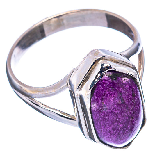 Sterling silver ring with oval purple gemstone bezel and twisted band.