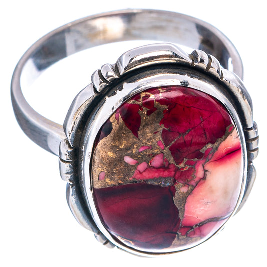 Sterling silver gemstone ring with oval red stone set in split band, angled view