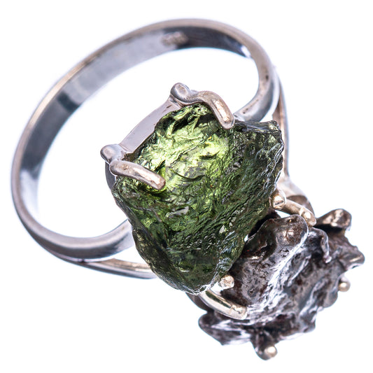 Sterling silver ring with green moldavite centerpiece on dark meteorite