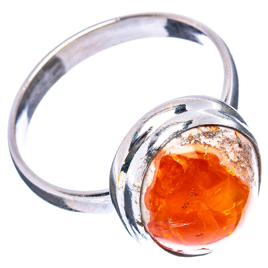 Sterling silver ring with oval orange fire opal bezel and textured band
