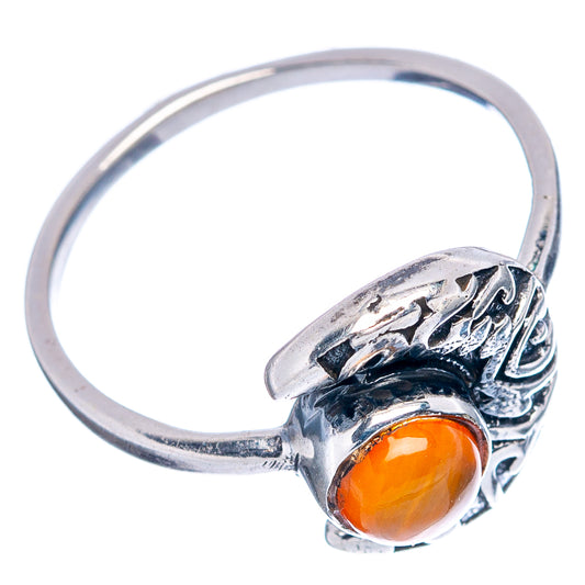 Sterling silver carnelian dainty ring side view with orange cabochon moon bezel