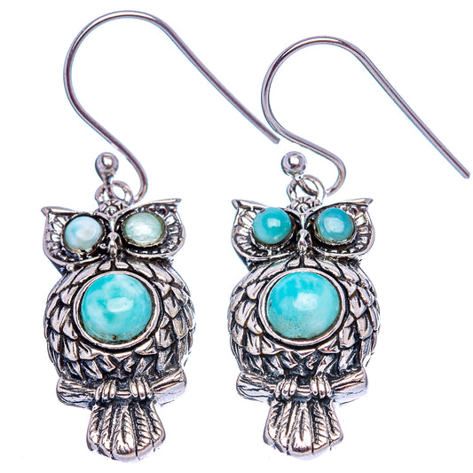 925 sterling silver owl earrings with turquoise-blue oval cabochons and fishhook closures.