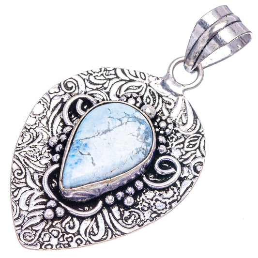 Ornate silver filigree Larimar pendant, pear-shaped light blue stone with bail