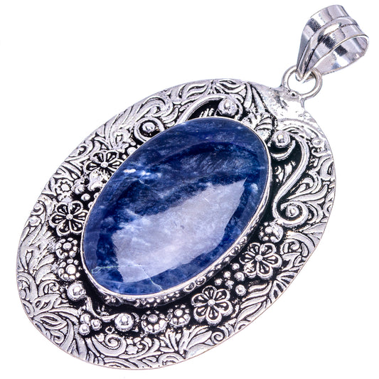 German silver oval sodalite pendant with detailed filigree frame and hanging loop