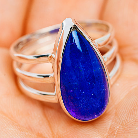 Sterling silver tanzanite ring with large oval blue gemstone, top view on hand