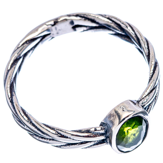 Sterling silver twisted rope band ring with oval green peridot gemstone in bezel
