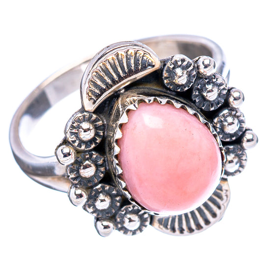 Pink oval opal ring in sterling silver with raised bead and floral side details