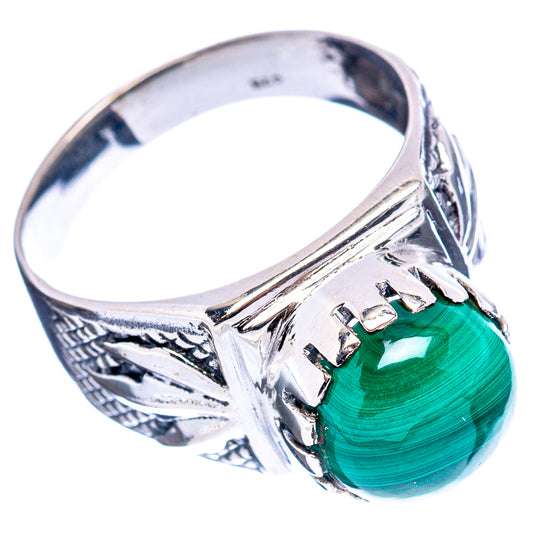 Sterling silver ring with green cabochon and engraved filigree side band
